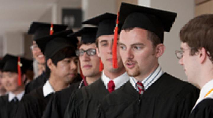 Graduates line up to receive diplomas