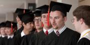 Graduates line up to receive diplomas