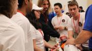Sam Noles works with Cornell Rocketry Project Teams members. 