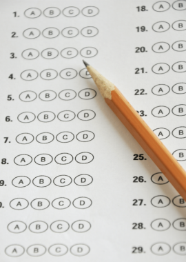 Stock photo of a sharpened pencil and standardized test answer sheet