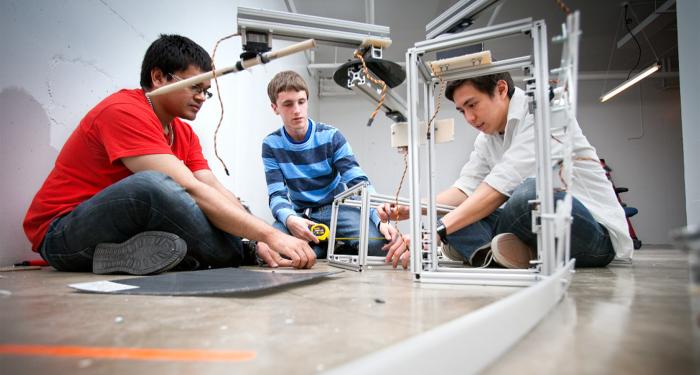 Members of the Cornell Cup engineering team working on modular robot